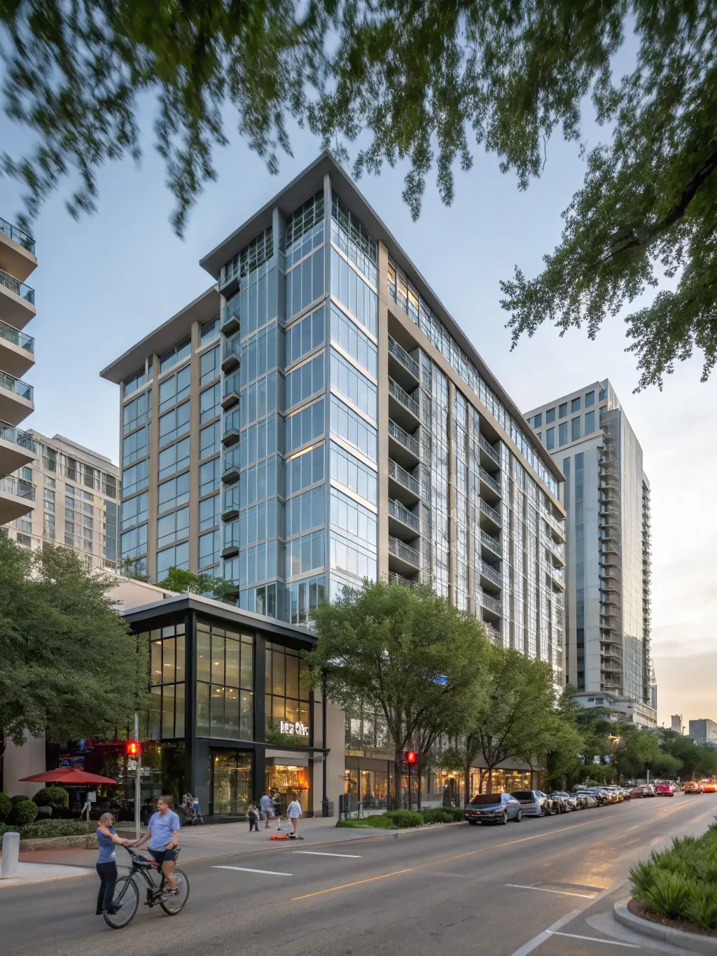A modern condo building in Stone Oak, featuring contemporary architecture and lush landscaping, reflecting the upscale lifestyle of the neighborhood.